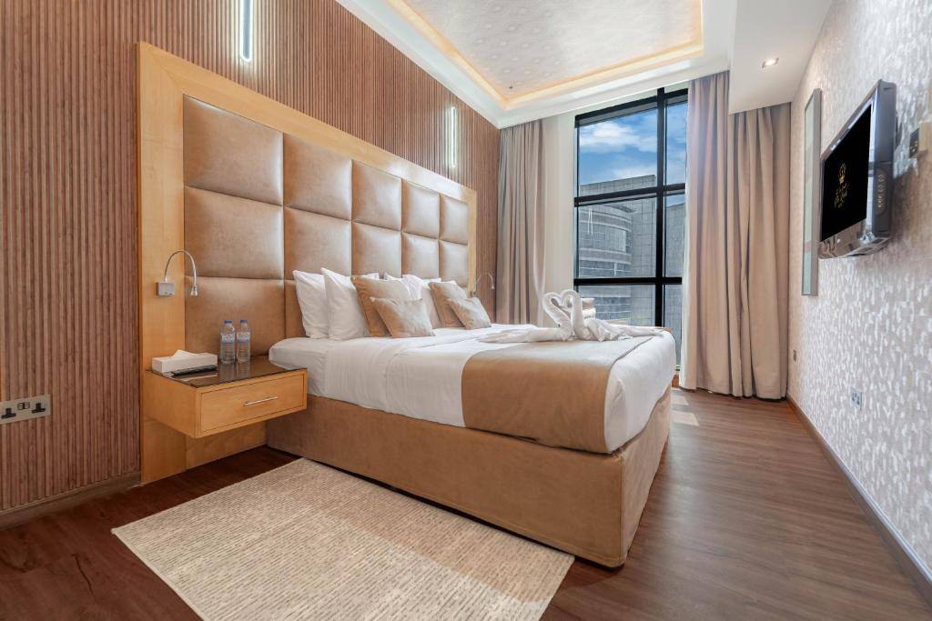 Hotel room with leather headboard and city window